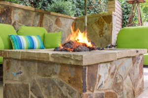 backyard fire pit, stone fire pit, tan stone fire pit