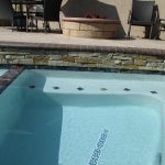 Spa with raised bond beam and trim tile