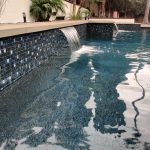 pool with raised bond beams, 2 sheet flows and 1x1 tiles