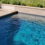 pool pebble raised bond beam